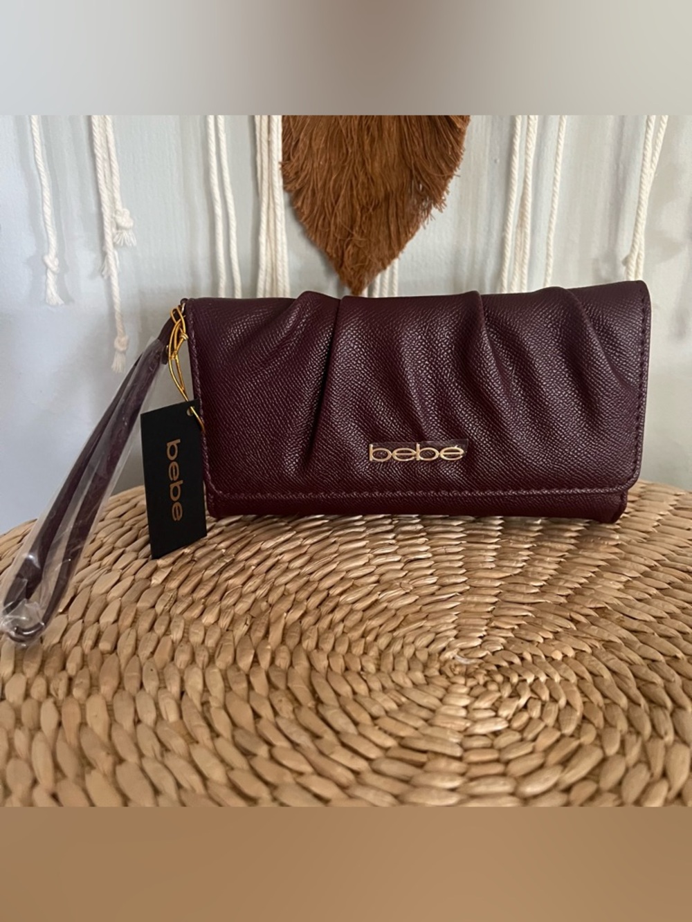 bebe Women's dark plum Wristlet Clutch